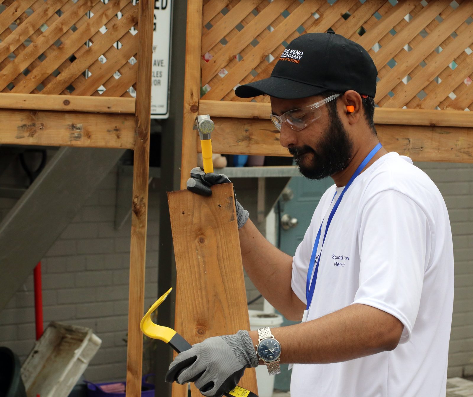 Site Squad Bootcamp LE student de-nailing a board during demolition cleanup training in Toronto