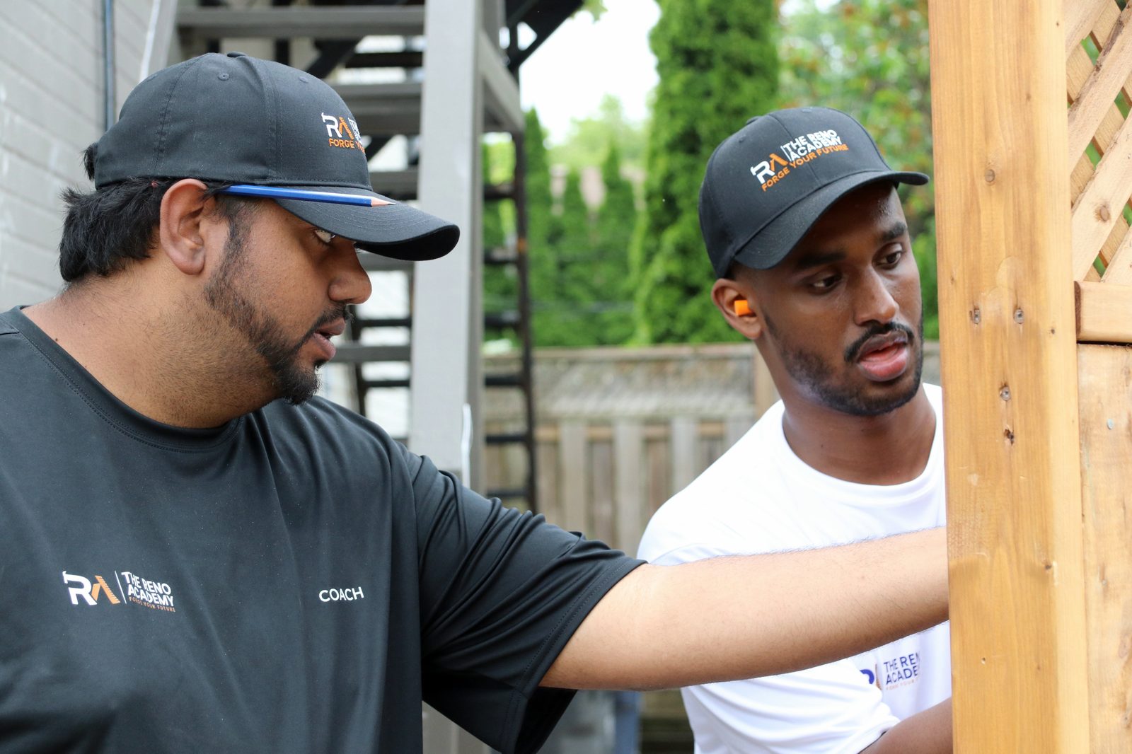 Reno Academy coach coaching a Site Squad Bootcamp LE student one-on-one at a Toronto training site