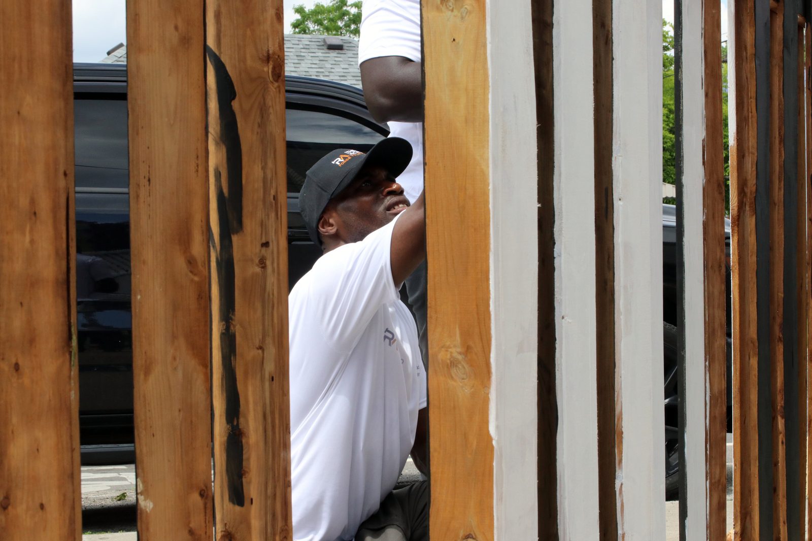 Reno Academy trainees working through a cedar fence build during outdoor trades training in Toronto